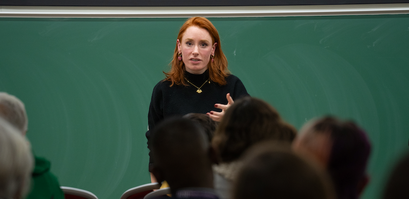 Hannah Fry in front of an audience at the Communicating Mathematics and Data Sciences event in Cambridge 