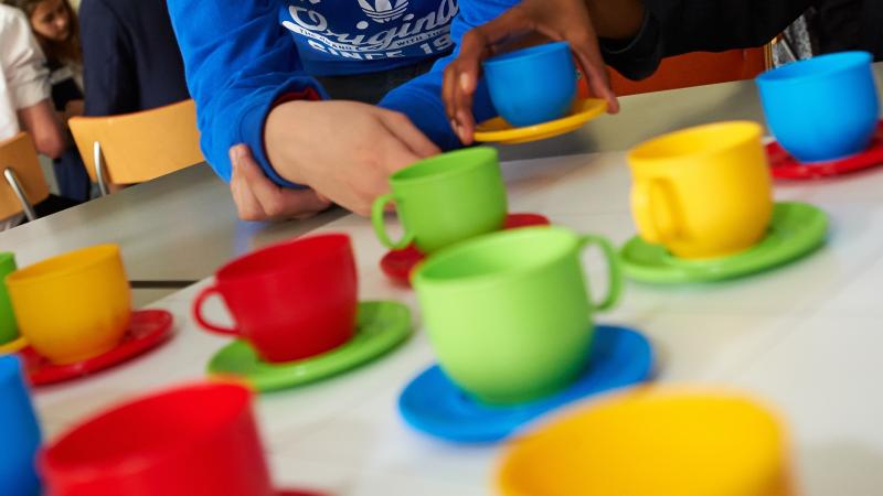 Students working on the NRICH hands-on Teacups activity